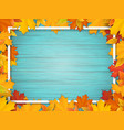autumn leaves and frame on old wooden background vector image vector image