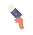 human hand holding passport with tickets isolated vector image